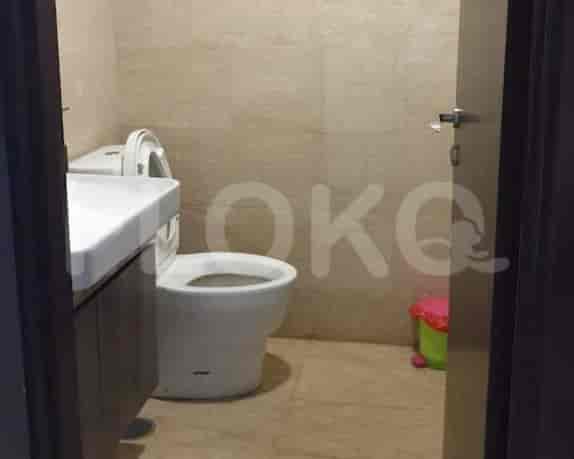 A small bathroom with a toilet and sink.