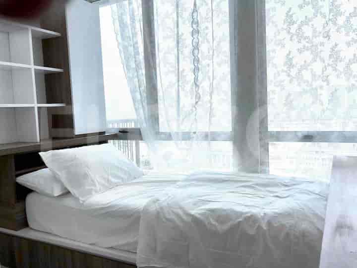 Another view of the bedroom with a large bed.