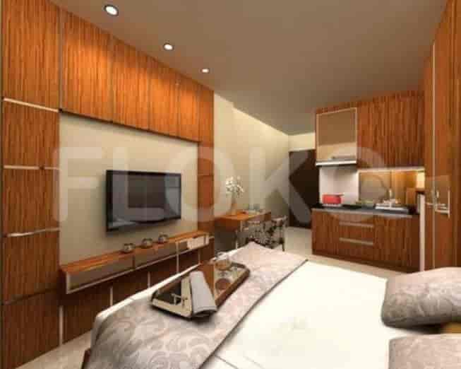 A small bedroom with kitchenette, showcasing bed, artwork, and wooden storage.