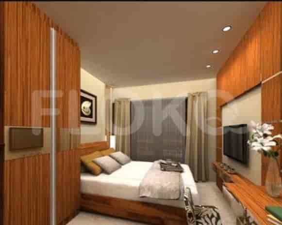 A compact bedroom with kitchenette, showing bed, closet, and art.