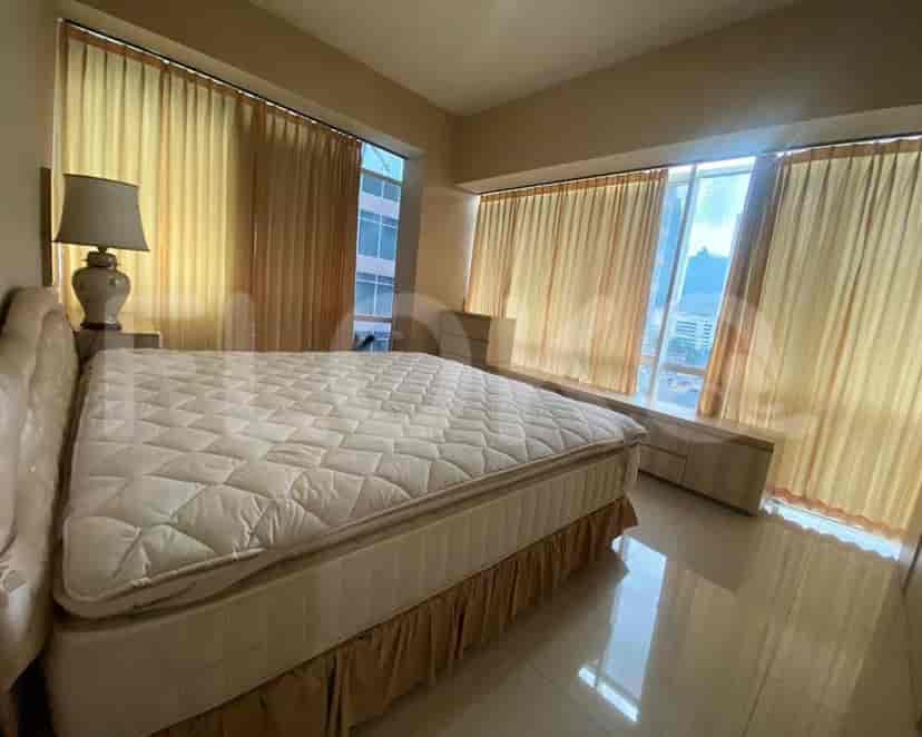 Bedroom with a large bed and window.