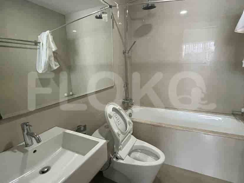 A bathroom features a sink, bathtub, and a toilet.