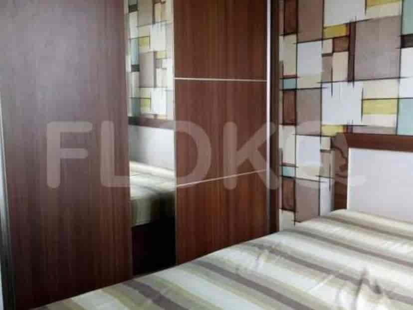 Bedroom with wardrobe and bed.