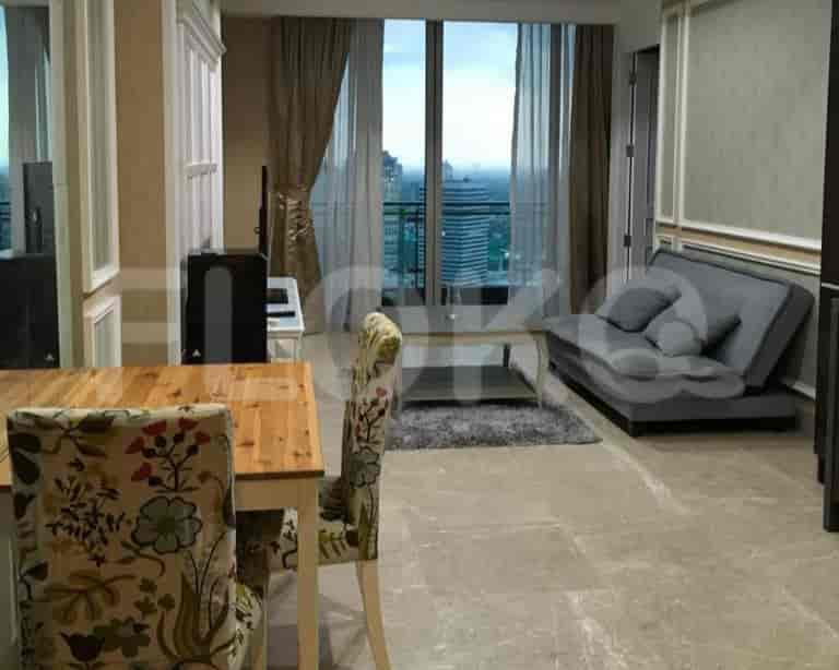 Living room with wooden dining table, modern furniture, and large window overlooking the city.