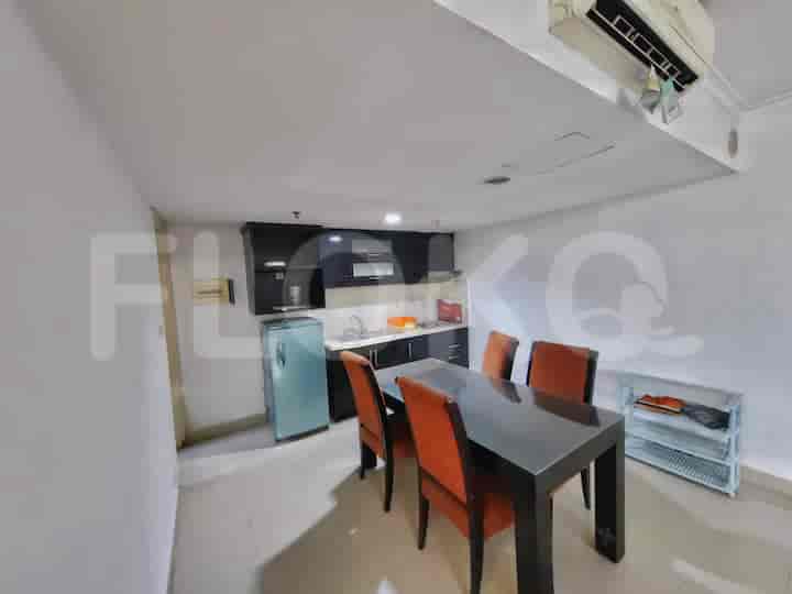 Well-equipped kitchen with dining table for casual dining.
