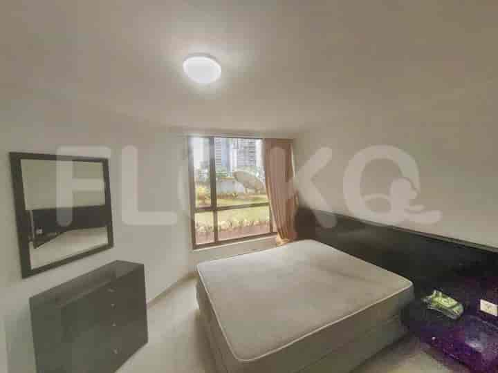 Bedroom with a double bed and a window.
