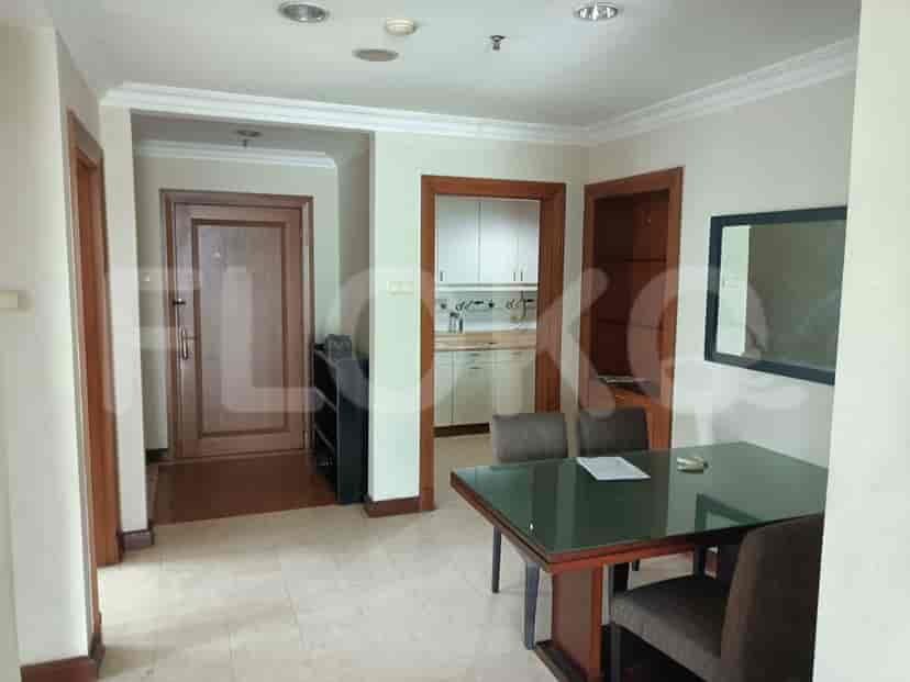 Dining area with a dining table, chairs, and access to the kitchen.