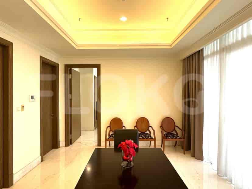 Living room with table and chairs.