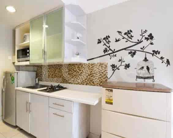 A compact and functional kitchen space with essential appliances and storage.