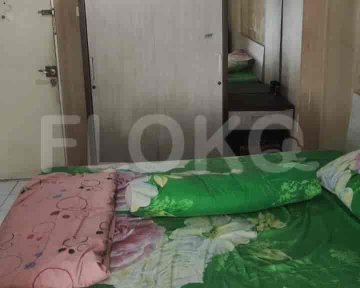 Bedroom featuring a double bed, wardrobe, and mirror.