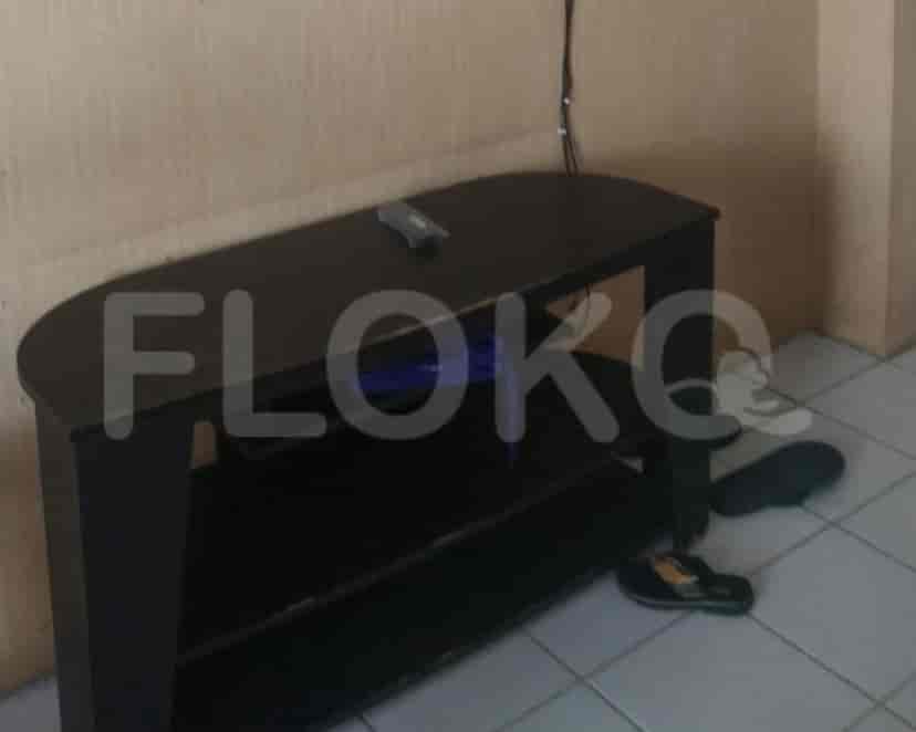Living area with a black entertainment unit.