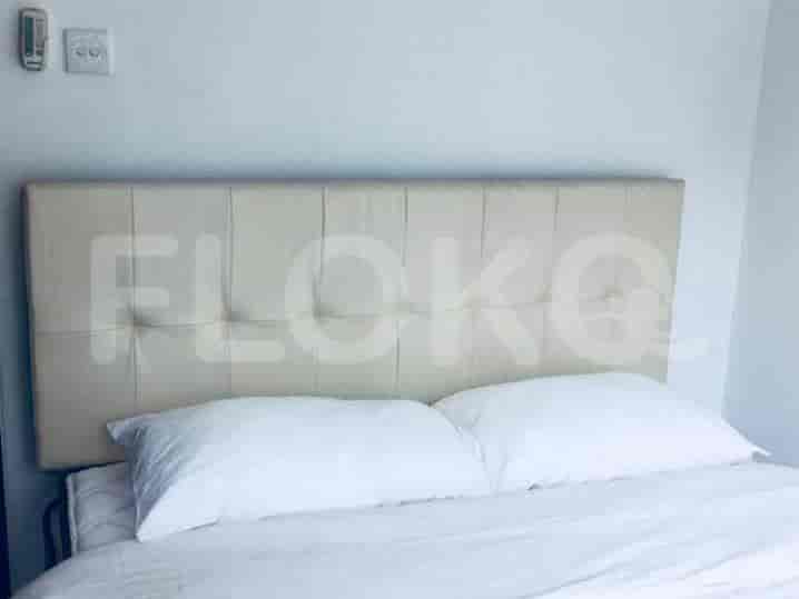 A cozy bedroom featuring a bed with a headboard.