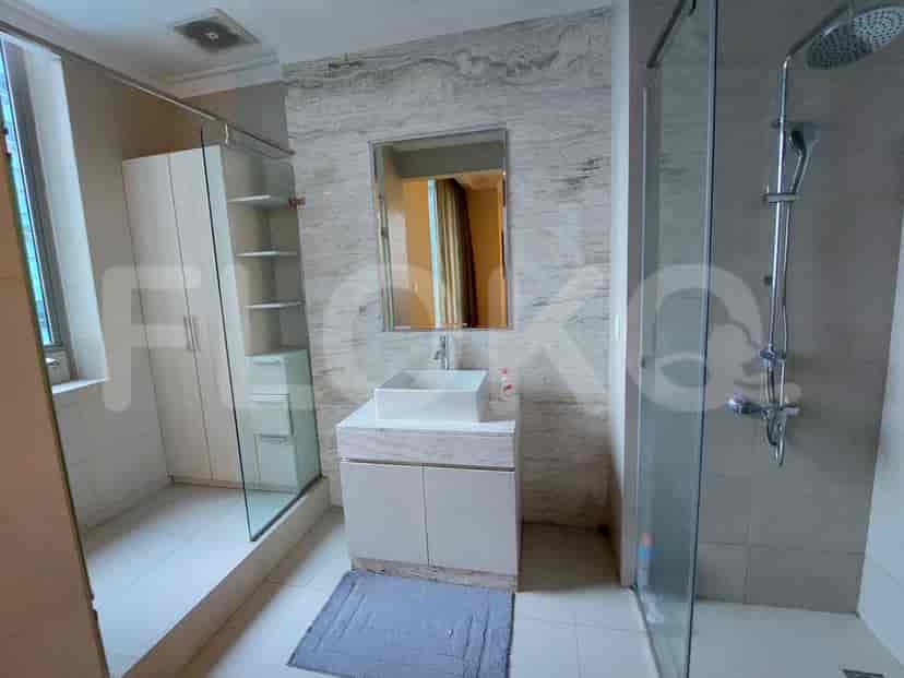 Modern bathroom with a shower, vanity, and storage.