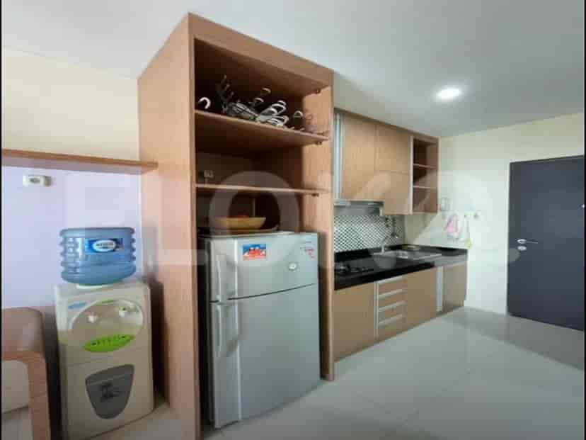 A compact kitchen area with essential appliances.