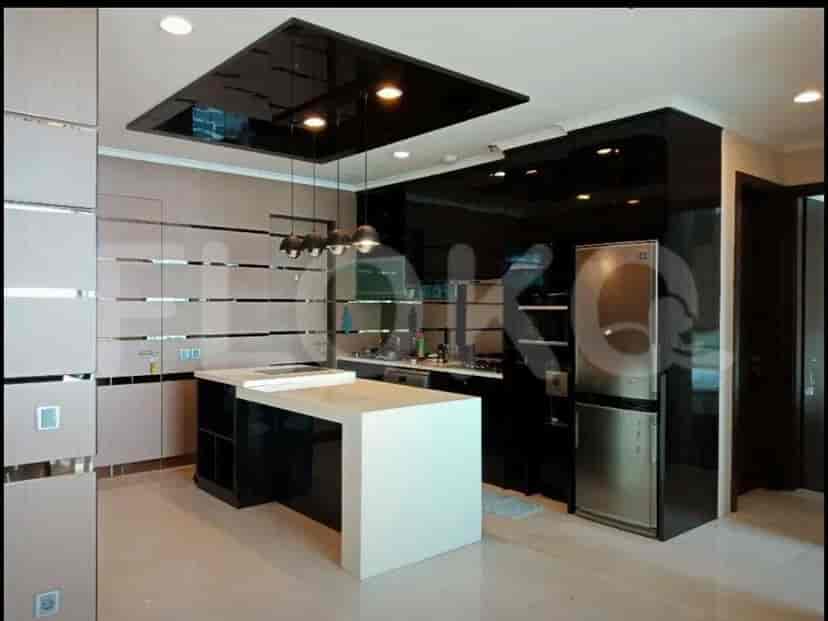 A modern kitchen with a breakfast bar and appliances.
