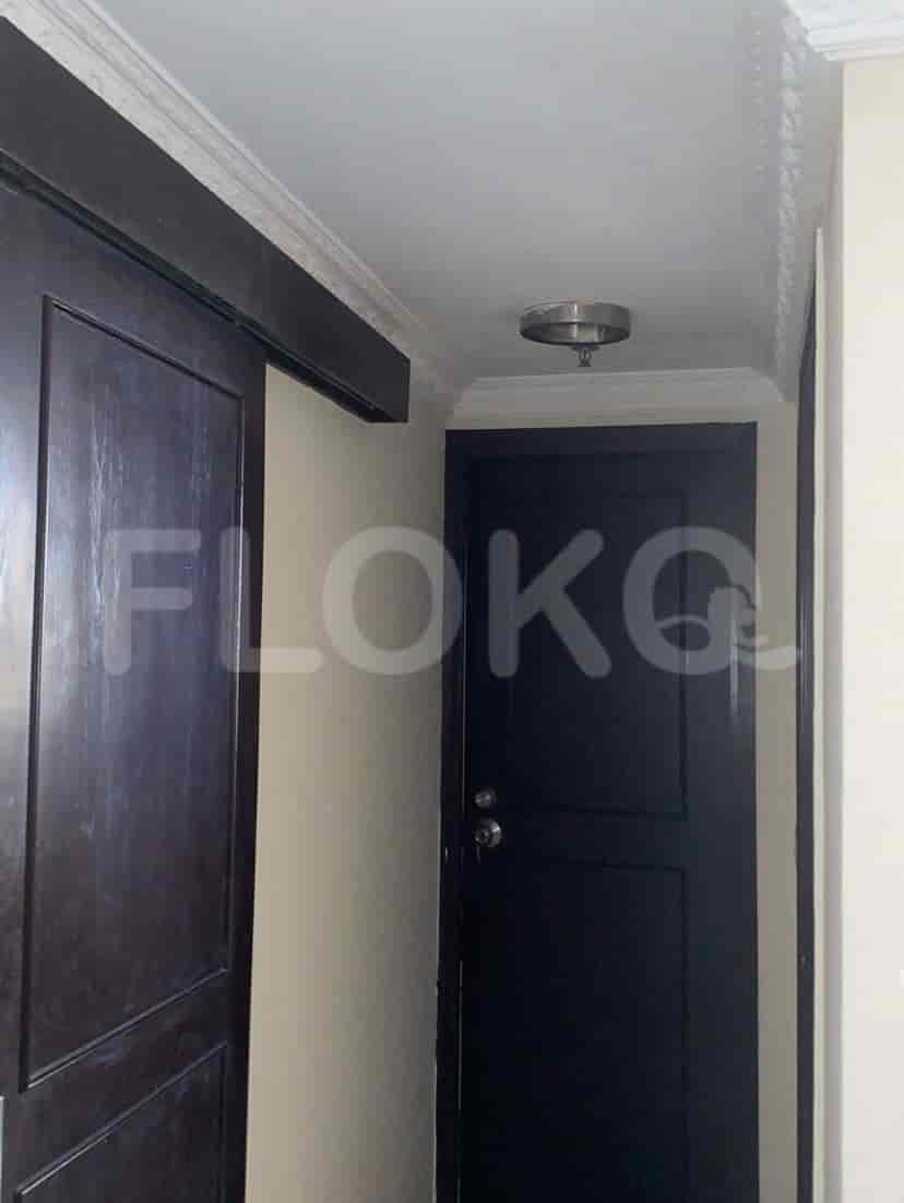 A hallway with a door.