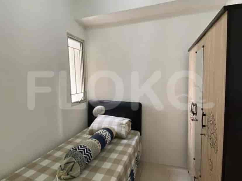 A bedroom with a single bed and a wardrobe.