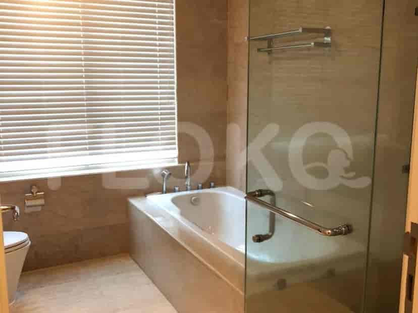 A bathroom featuring a bathtub, shower, and modern fixtures.