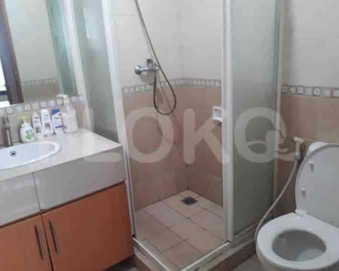 Bathroom with a shower, sink, and toilet.