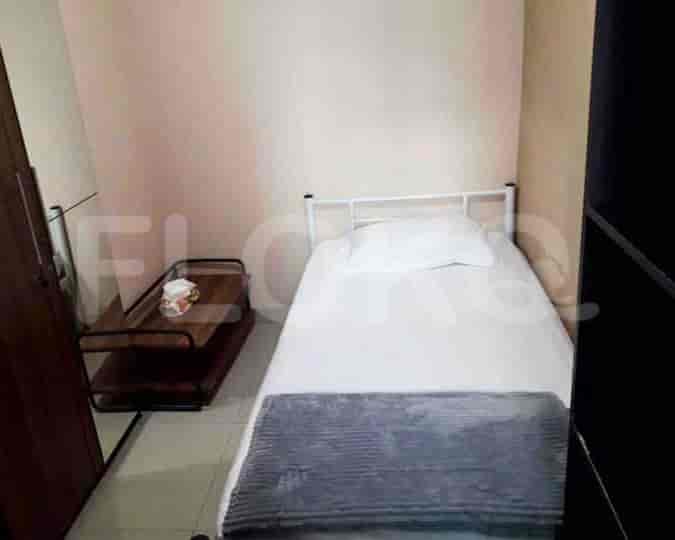 Small bedroom with a single bed.
