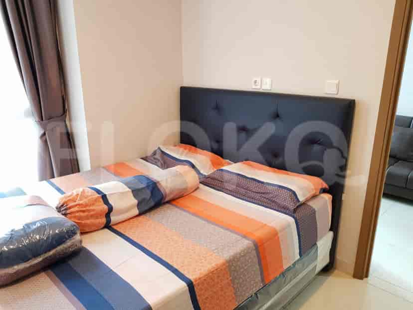 Kamar tidur yang nyaman dengan tempat tidur dan dekorasi sederhana.