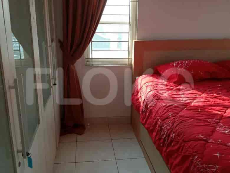 Bedroom with bed and curtains.
