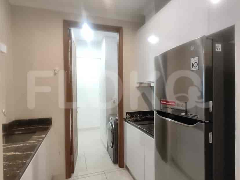 Modern kitchen with stainless steel appliances.