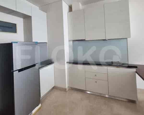 A modern kitchen with sleek cabinetry, stainless steel appliances, and a breakfast bar.
