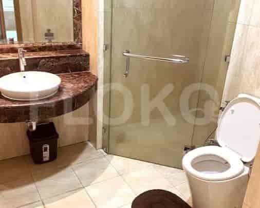 Bathroom featuring a modern sink, shower enclosure and toilet.
