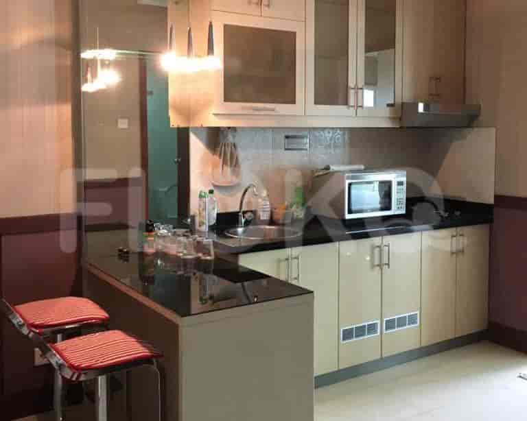 Kitchen with bar stools and countertop.