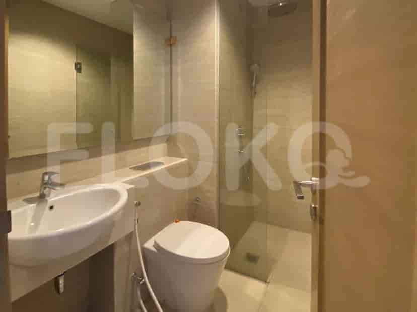 Bathroom with shower, toilet, and sink.