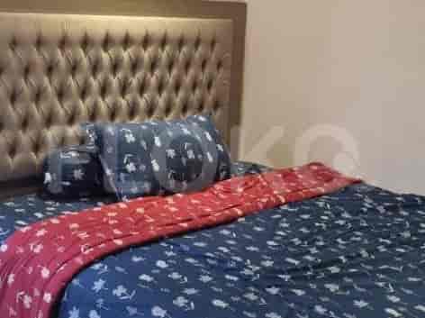 A bedroom with a blue and red themed bed.