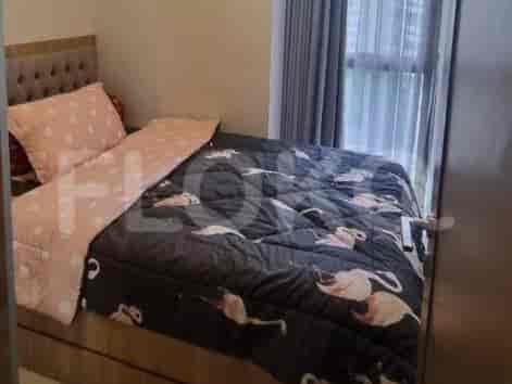 A bedroom with a black flamingo themed bed.