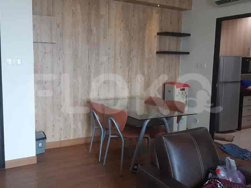 Dining area adjacent to the living space, featuring a table and chairs.
