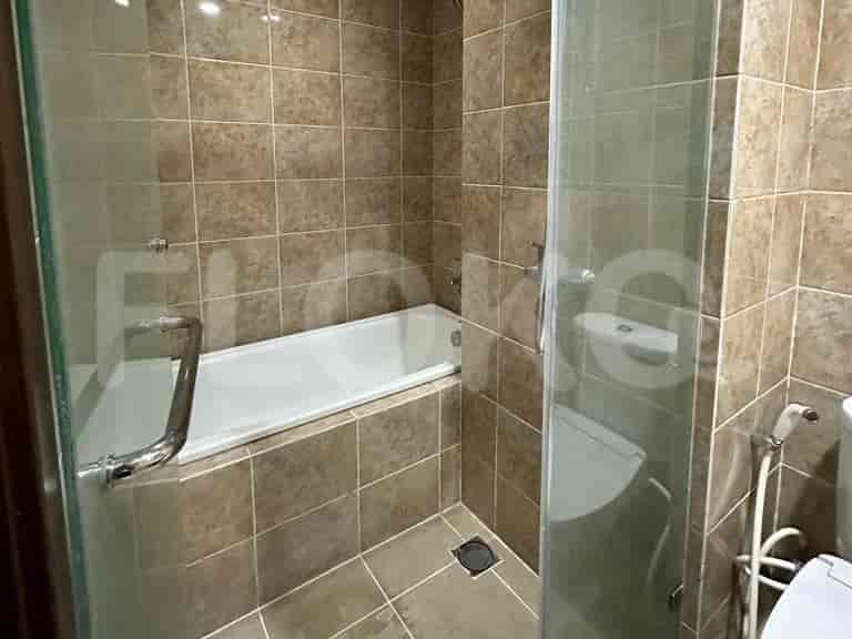 Bathroom with bathtub and shower area.