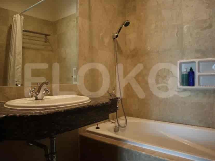 A bathroom with a bathtub and a sink.