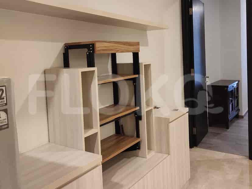 A room with shelves and a cabinet.