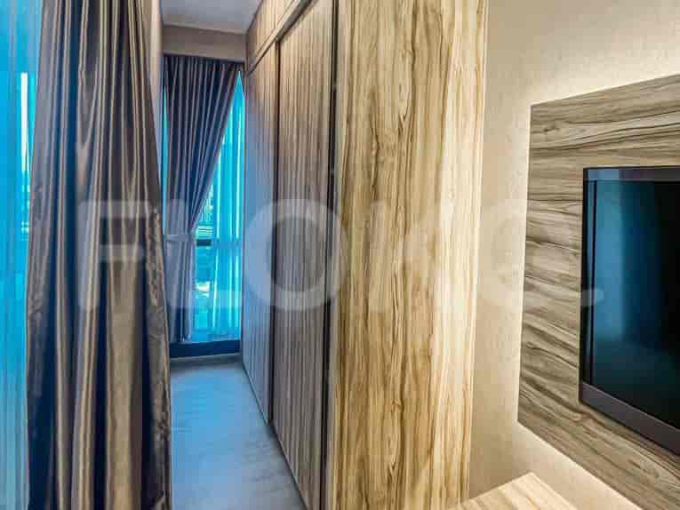 A modern bedroom with sliding closet doors.