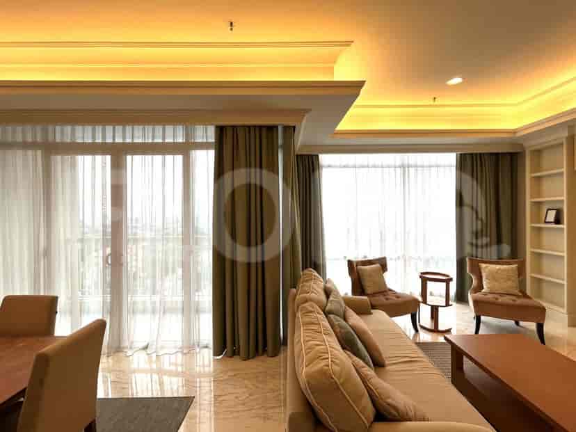 A spacious living room with a dining area and sofa set.