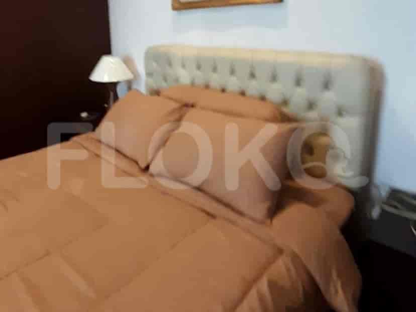 Bedroom with a bed and bedside table.