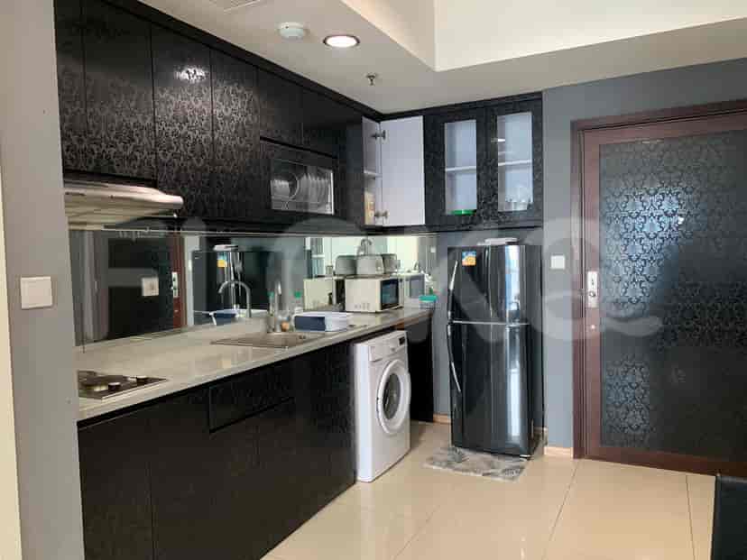 Kitchen with appliances and black cabinets.