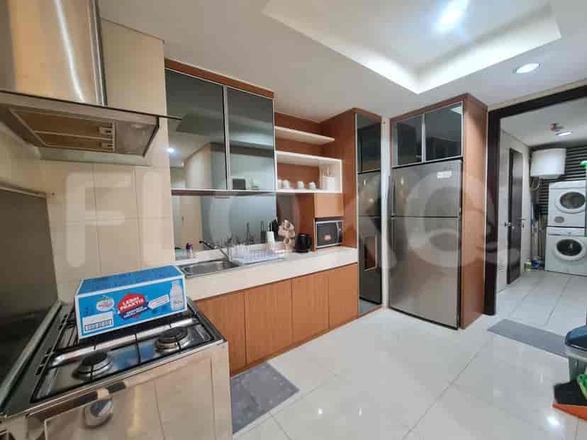 Modern kitchen with stainless steel appliances.