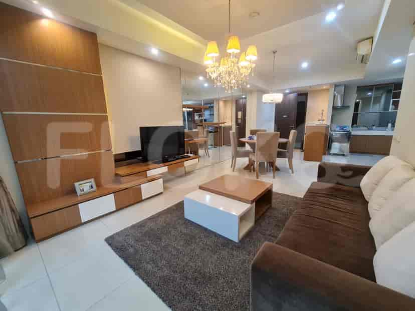 Open-plan living and dining space with a mirrored wall.