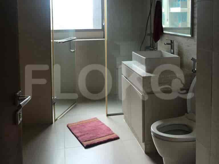A modern bathroom with a glass shower and minimalist design.