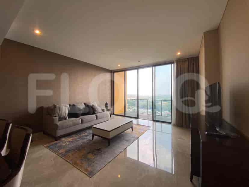 Spacious living room with a grey sofa, coffee table, and large window.