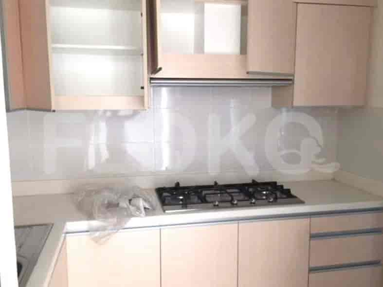 Modern kitchen featuring a gas stove, overhead cabinets, and countertop space.
