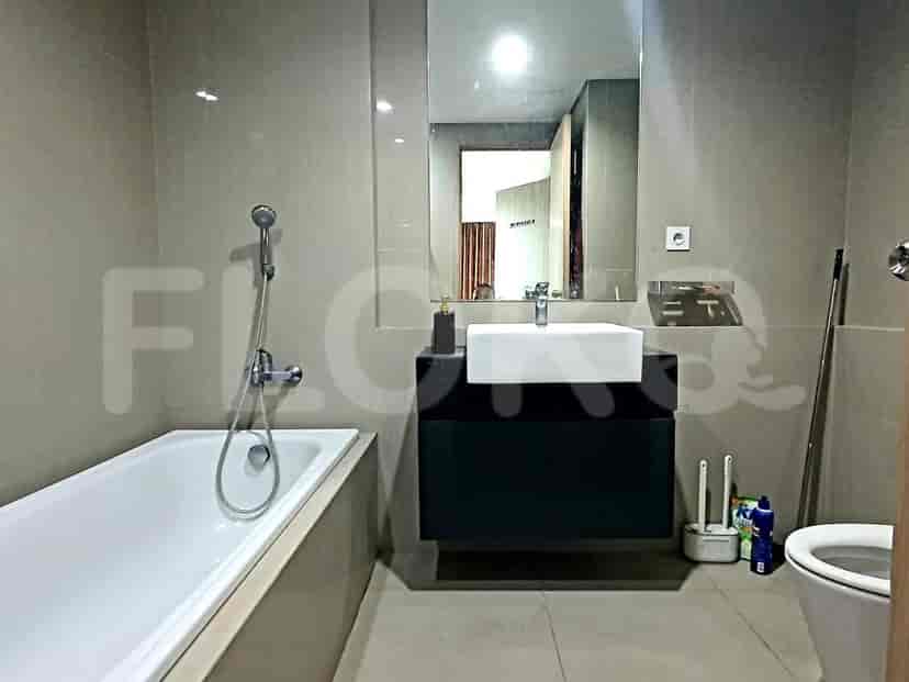 Bathroom with a bathtub and modern fixtures.