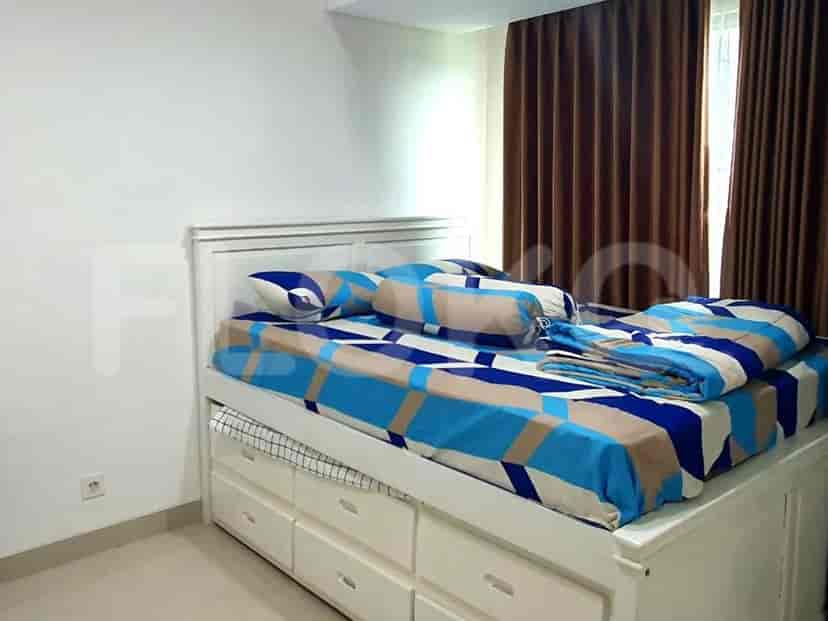 Bedroom with a bed and storage drawers.