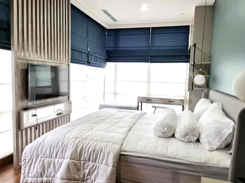 Bedroom featuring a large bed and a window.