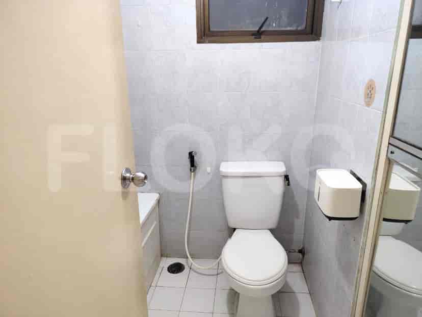 Bathroom with a toilet, sink, and bathtub.